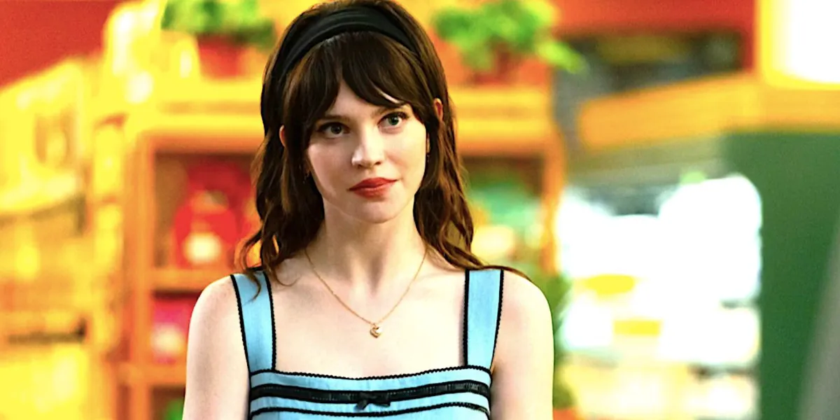 Sophie Thatcher as Iris looks uncertain in a supermarket in Companion 2025