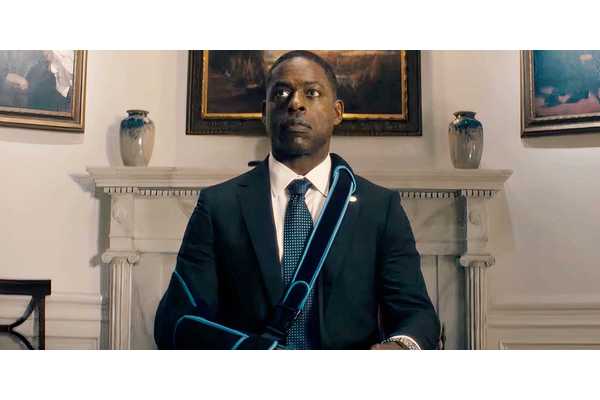 Paradise Season 2 BTS Image Shows Xavier Collins Handcuffed, Shirtless, & Badly Injured