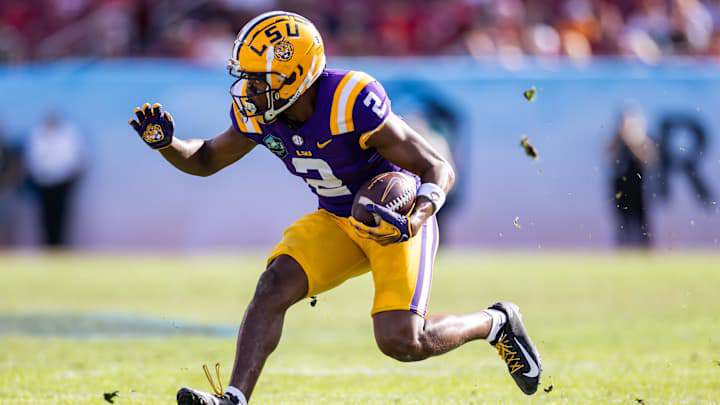 Jan 1, 2024; Tampa, FL, USA; LSU Tigers wide receiver Kyren Lacy (2) runs with the ball during the second half against the Wisconsin Badgers. Jan 1, 2024; Tampa, FL, USA; LSU Tigers wide receiver Kyren Lacy (2) runs with the ball during the second half against the Wisconsin Badgers.