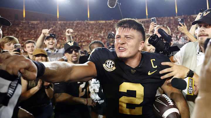Oct 5, 2024; Nashville, Tennessee, USA; Vanderbilt Commodores quarterback Diego Pavia celebrates with fans after defeating the Alabama Crimson Tide during the second half at FirstBank Stadium. Oct 5, 2024; Nashville, Tennessee, USA; Vanderbilt Commodores quarterback Diego Pavia celebrates with fans after defeating the Alabama Crimson Tide during the second half at FirstBank Stadium.