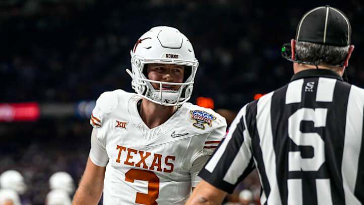 Texas Longhorns quarterback Quinn Ewers (3) talks to an official during the Sugar Bowl College Texas Longhorns quarterback Quinn Ewers (3) talks to an official during the Sugar Bowl College