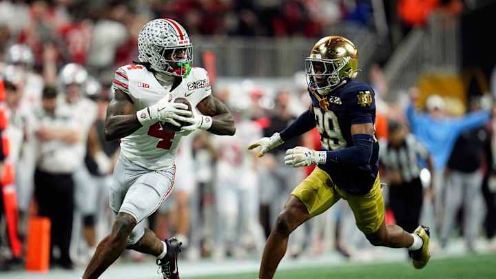 Ohio State Buckeyes wide receiver Jeremiah Smith (4) makes a catch against Notre Dame Fighting Irish cornerback Christian Gray (29) in the fourth quarter during the College Football Playoff National Championship at Mercedes-Benz Stadium in Atlanta on January 20, 2025. Ohio State Buckeyes wide receiver Jeremiah Smith (4) makes a catch against Notre Dame Fighting Irish cornerback Christian Gray (29) in the fourth quarter during the College Football Playoff National Championship at Mercedes-Benz Stadium in Atlanta on January 20, 2025.