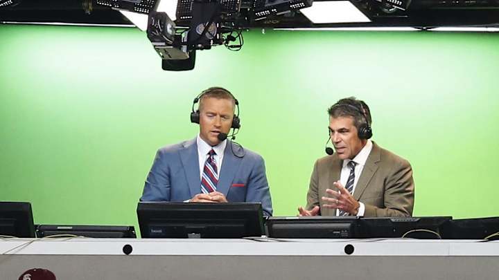 Aug 30, 2014; Arlington, TX, USA; ESPN broadcasters Kirk Herbstreit (right) and Chris Fowler announce the game with the Florida State Seminoles playing against the Oklahoma State Cowboys at AT&T Stadium. Mandatory Credit: Matthew Emmons-USA TODAY Sports Aug 30, 2014; Arlington, TX, USA; ESPN broadcasters Kirk Herbstreit (right) and Chris Fowler announce the game with the Florida State Seminoles playing against the Oklahoma State Cowboys at AT&T Stadium. Mandatory Credit: Matthew Emmons-USA TODAY Sports
