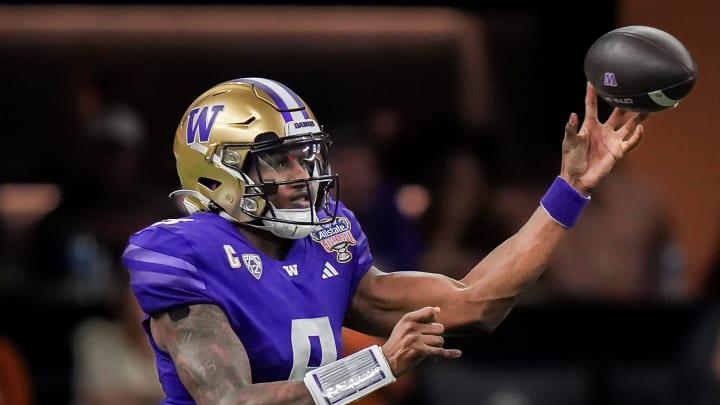 Washington Huskies quarterback Michael Penix Jr. (9) pass the ball during the Sugar Bowl College Washington Huskies quarterback Michael Penix Jr. (9) pass the ball during the Sugar Bowl College