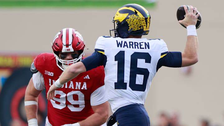 Michigan Wolverines quarterback Davis Warren (16) throws... Michigan Wolverines quarterback Davis Warren (16) throws...