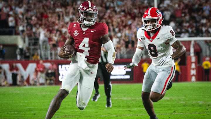 Georgia Bulldogs defensive back Joenel Aguero (8) pursues Alabama Crimson Tide quarterback Jalen Milroe (4) Georgia Bulldogs defensive back Joenel Aguero (8) pursues Alabama Crimson Tide quarterback Jalen Milroe (4)