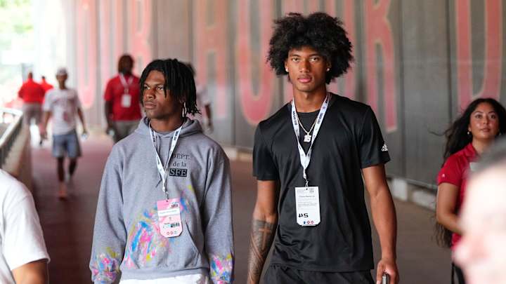 Aug 31, 2024; Columbus, OH, USA; Ohio State Buckeyes recruits Kayden Dixon-Wyatt and Chris Henry Jr. walk onto the field prior to the NCAA football game against the Akron Zips at Ohio Stadium. Ohio State won 52-6. Aug 31, 2024; Columbus, OH, USA; Ohio State Buckeyes recruits Kayden Dixon-Wyatt and Chris Henry Jr. walk onto the field prior to the NCAA football game against the Akron Zips at Ohio Stadium. Ohio State won 52-6.