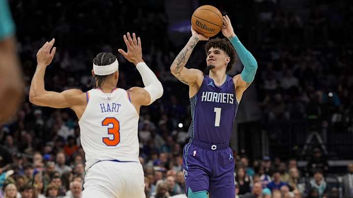 Mar 20, 2025; Charlotte, North Carolina, USA;Charlotte Hornets guard LaMelo Ball (1) shoots a three over New York Knicks guard Josh Hart (3) during the second half at Spectrum Center. Mandatory Credit: Jim Dedmon-Imagn Images Mar 20, 2025; Charlotte, North Carolina, USA;Charlotte Hornets guard LaMelo Ball (1) shoots a three over New York Knicks guard Josh Hart (3) during the second half at Spectrum Center. Mandatory Credit: Jim Dedmon-Imagn Images