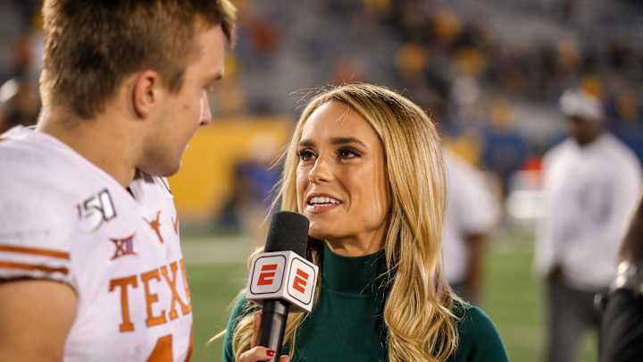 Oct 5, 2019; Morgantown, WV, USA; ESPN broadcaster Molly McGrath interviews Texas Longhorns quarterback Sam Ehlinger. Oct 5, 2019; Morgantown, WV, USA; ESPN broadcaster Molly McGrath interviews Texas Longhorns quarterback Sam Ehlinger.
