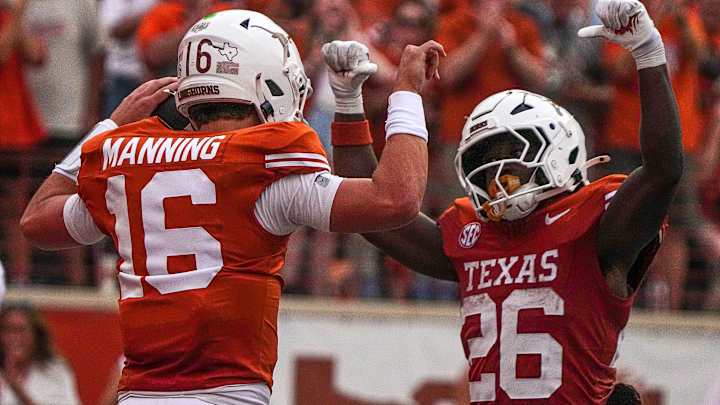 Texas Longhorns quarterback Arch Manning (16) and running back Quintrevion Wisner (26)  Texas Longhorns quarterback Arch Manning (16) and running back Quintrevion Wisner (26)