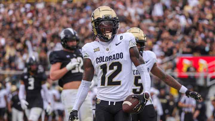 Sep 28, 2024; Orlando, Florida, USA; Colorado Buffaloes wide receiver Travis Hunter (12) scores a touchdown against the UCF Knights during the first quarter at FBC Mortgage Stadium. Mandatory Credit: Mike Watters-Imagn Images Sep 28, 2024; Orlando, Florida, USA; Colorado Buffaloes wide receiver Travis Hunter (12) scores a touchdown against the UCF Knights during the first quarter at FBC Mortgage Stadium. Mandatory Credit: Mike Watters-Imagn Images