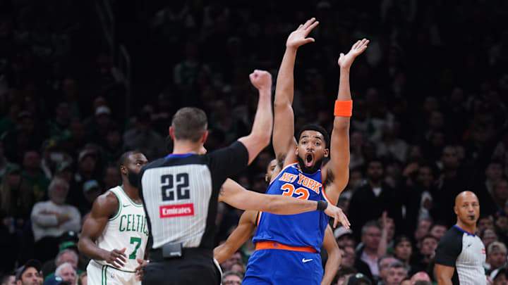 May 5, 2025; Boston, Massachusetts, USA; New York Knicks center Karl-Anthony Towns (32) called for the foul against Boston Celtics forward Jayson Tatum (0) in the first quarter during game one of the second round for the 2025 NBA Playoffs at TD Garden. Mandatory Credit: David Butler II-Imagn Images May 5, 2025; Boston, Massachusetts, USA; New York Knicks center Karl-Anthony Towns (32) called for the foul against Boston Celtics forward Jayson Tatum (0) in the first quarter during game one of the second round for the 2025 NBA Playoffs at TD Garden. Mandatory Credit: David Butler II-Imagn Images