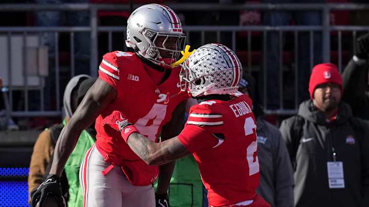 Jeremiah Smith #4 of the Ohio State Buckeyes celebrates after his touchdown reception against the Michigan Wolverines with Emeka Egbuka #2 during the second quarter at Ohio Stadium on November 30, 2024 in Columbus, Ohio. Jeremiah Smith #4 of the Ohio State Buckeyes celebrates after his touchdown reception against the Michigan Wolverines with Emeka Egbuka #2 during the second quarter at Ohio Stadium on November 30, 2024 in Columbus, Ohio.