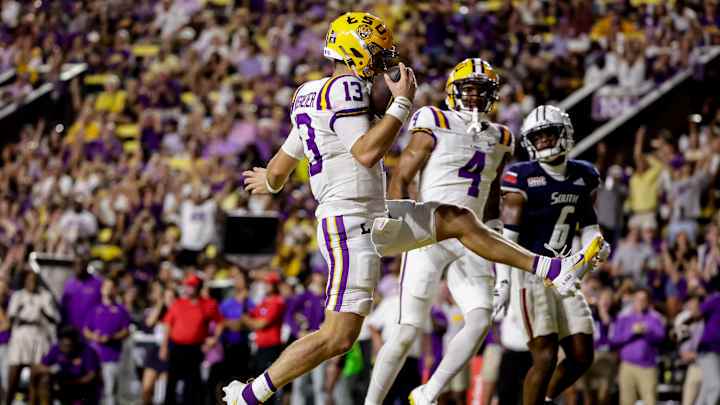 Garrett Nussmeier #13 of the LSU Tigers runs in for a touchdown against the South Alabama Jaguars during the first half at Tiger Stadium on September 28, 2024 in Baton Rouge, Louisiana. Garrett Nussmeier #13 of the LSU Tigers runs in for a touchdown against the South Alabama Jaguars during the first half at Tiger Stadium on September 28, 2024 in Baton Rouge, Louisiana.