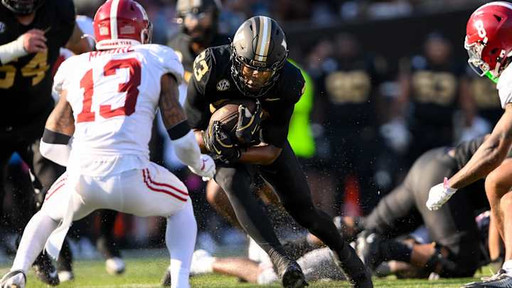 Oct 5, 2024; Nashville, Tennessee, USA; Alabama Crimson Tide defensive back Malachi Moore (13) tackles Vanderbilt Commodores running back AJ Newberry (23) at FirstBank Stadium. Oct 5, 2024; Nashville, Tennessee, USA; Alabama Crimson Tide defensive back Malachi Moore (13) tackles Vanderbilt Commodores running back AJ Newberry (23) at FirstBank Stadium.