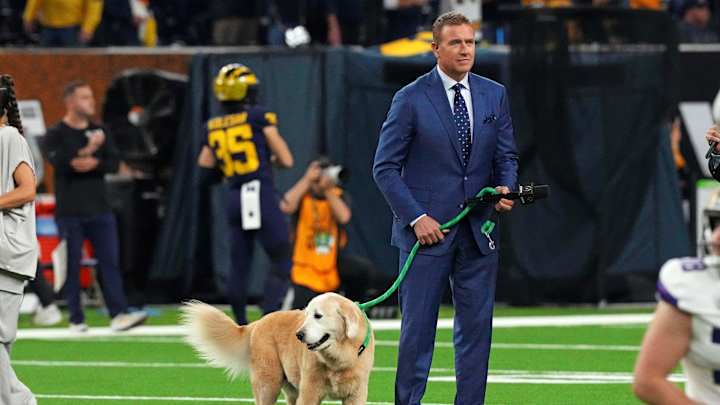 Jan 8, 2024; Houston, TX, USA; ESPN analyst Kirk Herbstreit walks his dog Ben before the 2024 College Football Playoff national championship game between the Michigan Wolverines and the Washington Huskies at NRG Stadium. Mandatory Credit: Kirby Lee-Imagn Images Jan 8, 2024; Houston, TX, USA; ESPN analyst Kirk Herbstreit walks his dog Ben before the 2024 College Football Playoff national championship game between the Michigan Wolverines and the Washington Huskies at NRG Stadium. Mandatory Credit: Kirby Lee-Imagn Images