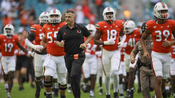 Oct 28, 2023; Miami Gardens, Florida, USA; Miami Hurricanes head coach Mario Cristobal takes on the Oct 28, 2023; Miami Gardens, Florida, USA; Miami Hurricanes head coach Mario Cristobal takes on the