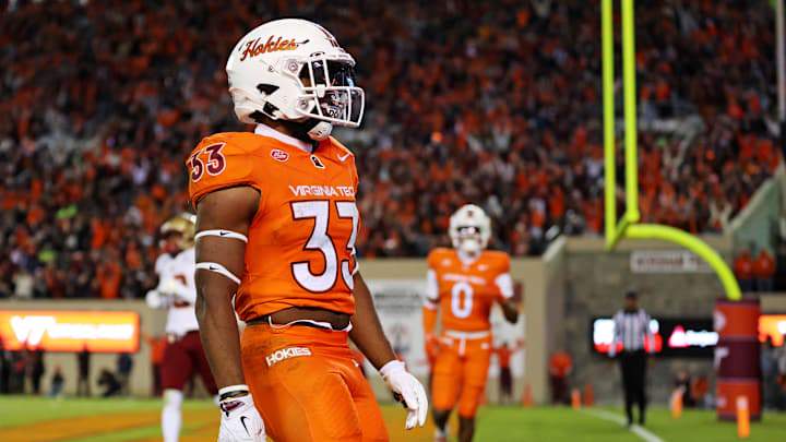 Oct 17, 2024; Blacksburg, Virginia, USA; Virginia Tech Hokies running back Bhayshul Tuten (33) celebrates after scoring a touchdown during the second quarter against the Boston College Eagles at Lane Stadium. Mandatory Credit: Peter Casey-Imagn Images Oct 17, 2024; Blacksburg, Virginia, USA; Virginia Tech Hokies running back Bhayshul Tuten (33) celebrates after scoring a touchdown during the second quarter against the Boston College Eagles at Lane Stadium. Mandatory Credit: Peter Casey-Imagn Images