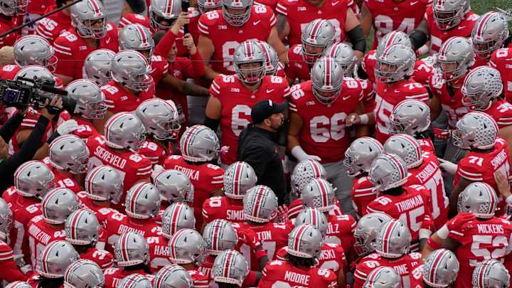 Ohio State coach Ryan Day huddles with his players before facing Maryland. Ohio State coach Ryan Day huddles with his players before facing Maryland.