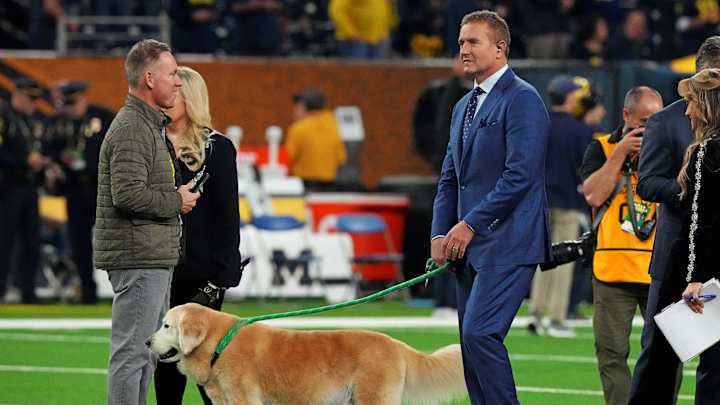 Jan 8, 2024; Houston, TX, USA; ESPN analyst Kirk Herbstreit walks his dog Ben before the 2024 College Football Playoff national championship game between the Michigan Wolverines and the Washington Huskies at NRG Stadium. Mandatory Credit: Kirby Lee-Imagn Images Jan 8, 2024; Houston, TX, USA; ESPN analyst Kirk Herbstreit walks his dog Ben before the 2024 College Football Playoff national championship game between the Michigan Wolverines and the Washington Huskies at NRG Stadium. Mandatory Credit: Kirby Lee-Imagn Images