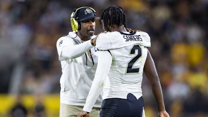 Colorado Buffaloes head coach Deion Sanders with son and quarterback Shedeur Sanders (2) Colorado Buffaloes head coach Deion Sanders with son and quarterback Shedeur Sanders (2)
