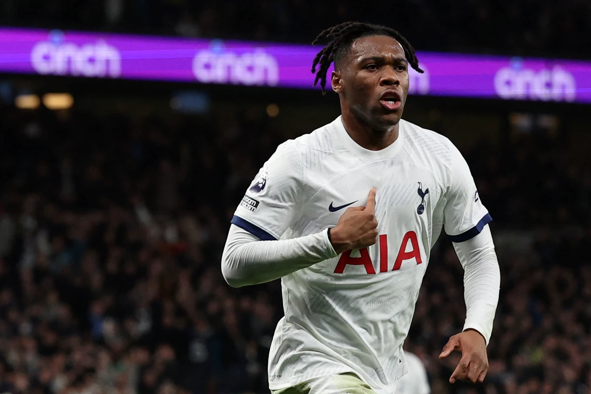 Tottenham Hotspur defender Destiny Udogie celebrates after scoring the opening goal of the English Premier League football match between Tottenham Hotspur and Newcastle United at Tottenham Hotspur Stadium in London, on December 10, 2023. (Photo by Adrian DENNIS / AFP) / RESTRICTED TO EDITORIAL USE. No use with unauthorized audio, video, data, fixture lists, club/league logos or 'live' services. Online in-match use limited to 120 images. An additional 40 images may be used in extra time. No video emulation. Social media in-match use limited to 120 images. An additional 40 images may be used in extra time. No use in betting publications, games or single club/league/player publications. / (Photo by ADRIAN DENNIS/AFP via Getty Images)