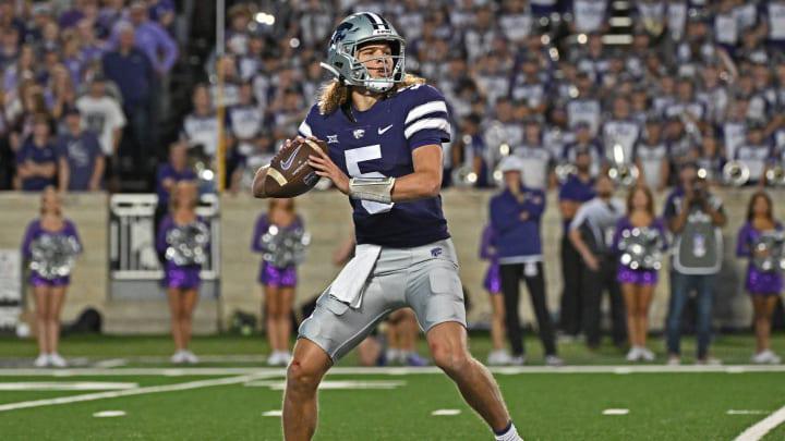 Quarterback Avery Johnson #5 of the Kansas State Wildcats runs throws a pass against the TCU Horned Frogs in the first half at Bill Snyder Family Football Stadium on October 21, 2023 in Manhattan, Kansas. Quarterback Avery Johnson #5 of the Kansas State Wildcats runs throws a pass against the TCU Horned Frogs in the first half at Bill Snyder Family Football Stadium on October 21, 2023 in Manhattan, Kansas.
