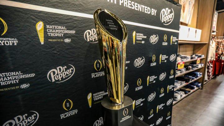Fans stop to take photos with the College Football National Championship trophy at Meijer in Fans stop to take photos with the College Football National Championship trophy at Meijer in
