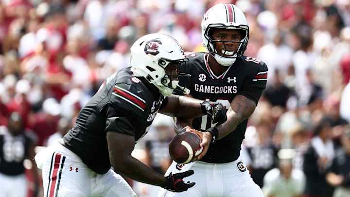 LaNorris Sellers #16 of the South Carolina Gamecocks hands the ball to Raheim Sanders #5 of the South Carolina Gamecocks during the second quarter at Williams-Brice Stadium on September 14, 2024 in Columbia, South Carolina. LaNorris Sellers #16 of the South Carolina Gamecocks hands the ball to Raheim Sanders #5 of the South Carolina Gamecocks during the second quarter at Williams-Brice Stadium on September 14, 2024 in Columbia, South Carolina.