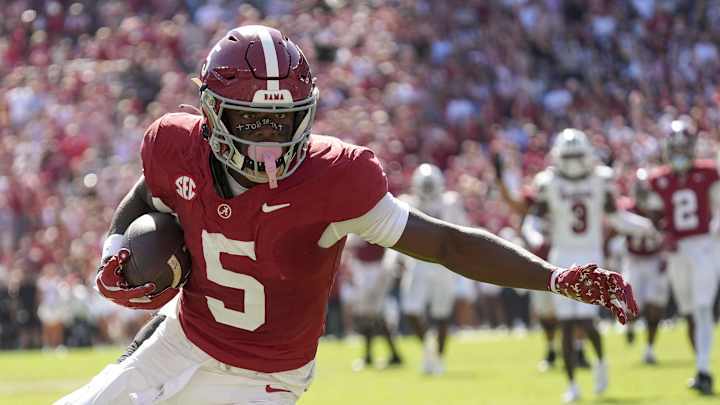 Oct 12, 2024; Tuscaloosa, Alabama, USA; Alabama Crimson Tide wide receiver Germie Bernard (5) scores after catching a pass from Alabama Crimson Tide quarterback Jalen Milroe (4) to seal the victory at Bryant-Denny Stadium. Alabama defeated South Carolina 27-25. Mandatory Credit: Gary Cosby Jr.-Imagn Images Oct 12, 2024; Tuscaloosa, Alabama, USA; Alabama Crimson Tide wide receiver Germie Bernard (5) scores after catching a pass from Alabama Crimson Tide quarterback Jalen Milroe (4) to seal the victory at Bryant-Denny Stadium. Alabama defeated South Carolina 27-25. Mandatory Credit: Gary Cosby Jr.-Imagn Images