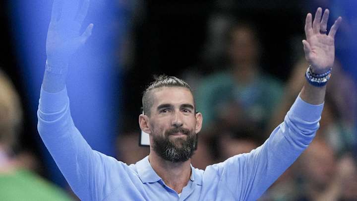 Jul 28, 2024; Nanterre, France; Michael Phelps waves to the crowd ahead of the night round of competition during the Paris 2024 Olympic Summer Games at Paris La Défense Arena. Mandatory Credit: Grace Hollars-Imagn Images Jul 28, 2024; Nanterre, France; Michael Phelps waves to the crowd ahead of the night round of competition during the Paris 2024 Olympic Summer Games at Paris La Défense Arena. Mandatory Credit: Grace Hollars-Imagn Images