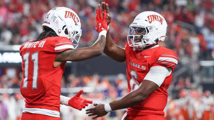 Ricky White III #11and Hajj-Malik Williams #6 of the UNLV Rebels celebrate after a touchdown during the fourth quarter of a game against the Syracuse Orange at Allegiant Stadium on October 04, 2024 in Las Vegas, Nevada. Ricky White III #11and Hajj-Malik Williams #6 of the UNLV Rebels celebrate after a touchdown during the fourth quarter of a game against the Syracuse Orange at Allegiant Stadium on October 04, 2024 in Las Vegas, Nevada.