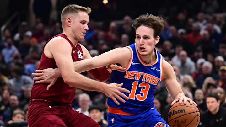 Apr 2, 2025; Cleveland, Ohio, USA; New York Knicks guard Tyler Kolek (13) drives to the basket against Cleveland Cavaliers guard Sam Merrill (5) during the first half at Rocket Arena. Mandatory Credit: Ken Blaze-Imagn Images Apr 2, 2025; Cleveland, Ohio, USA; New York Knicks guard Tyler Kolek (13) drives to the basket against Cleveland Cavaliers guard Sam Merrill (5) during the first half at Rocket Arena. Mandatory Credit: Ken Blaze-Imagn Images