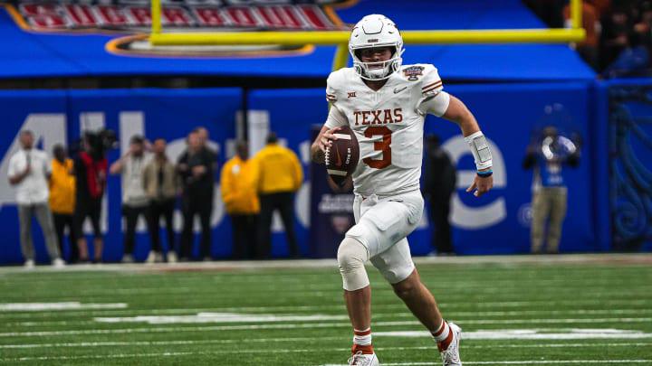 Texas Longhorns quarterback Quinn Ewers (3) runs the ball during the Sugar Bowl College Football Texas Longhorns quarterback Quinn Ewers (3) runs the ball during the Sugar Bowl College Football
