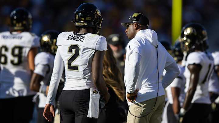 Colorado Buffaloes head coach Deion Sanders with son and quarterback Shedeur Sanders (2) Colorado Buffaloes head coach Deion Sanders with son and quarterback Shedeur Sanders (2)