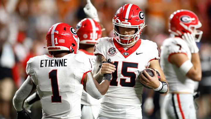 Carson Beck #15 and Trevor Etienne #1 of the Georgia Bulldogs celebrate after defeating the Texas Longhorns 30-15 at Darrell K Royal-Texas Memorial Stadium on October 19, 2024 in Austin, Texas. Carson Beck #15 and Trevor Etienne #1 of the Georgia Bulldogs celebrate after defeating the Texas Longhorns 30-15 at Darrell K Royal-Texas Memorial Stadium on October 19, 2024 in Austin, Texas.