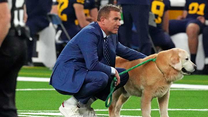 Jan 8, 2024; Houston, TX, USA; ESPN analyst Kirk Herbstreit walks his dog Ben before the 2024 College Football Playoff national championship game between the Michigan Wolverines and the Washington Huskies at NRG Stadium Jan 8, 2024; Houston, TX, USA; ESPN analyst Kirk Herbstreit walks his dog Ben before the 2024 College Football Playoff national championship game between the Michigan Wolverines and the Washington Huskies at NRG Stadium