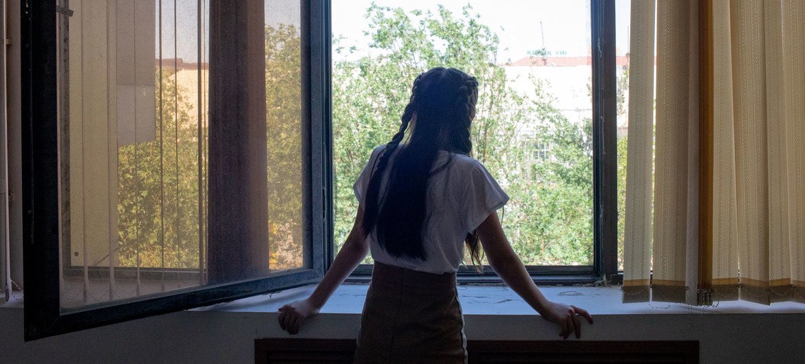 A 14-year-old girl looks out the window, in Kyzylorda, Kazakhstan. Recently, she has addressed feelings of stress and anxiety with the help of an educational psychologist. A 14-year-old girl looks out the window, in Kyzylorda, Kazakhstan. Recently, she has addressed feelings of stress and anxiety with the help of an educational psychologist.