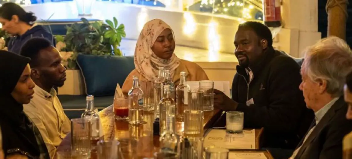 UN Secretary-General António Guterres (right) shares iftar with Sudanese refugees in Cairo, Egypt. 