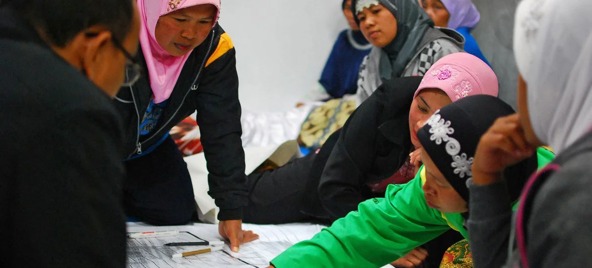 Women play an important role in community discussions after their village Yogyakarta was badly affected by a volcanic eruption. 