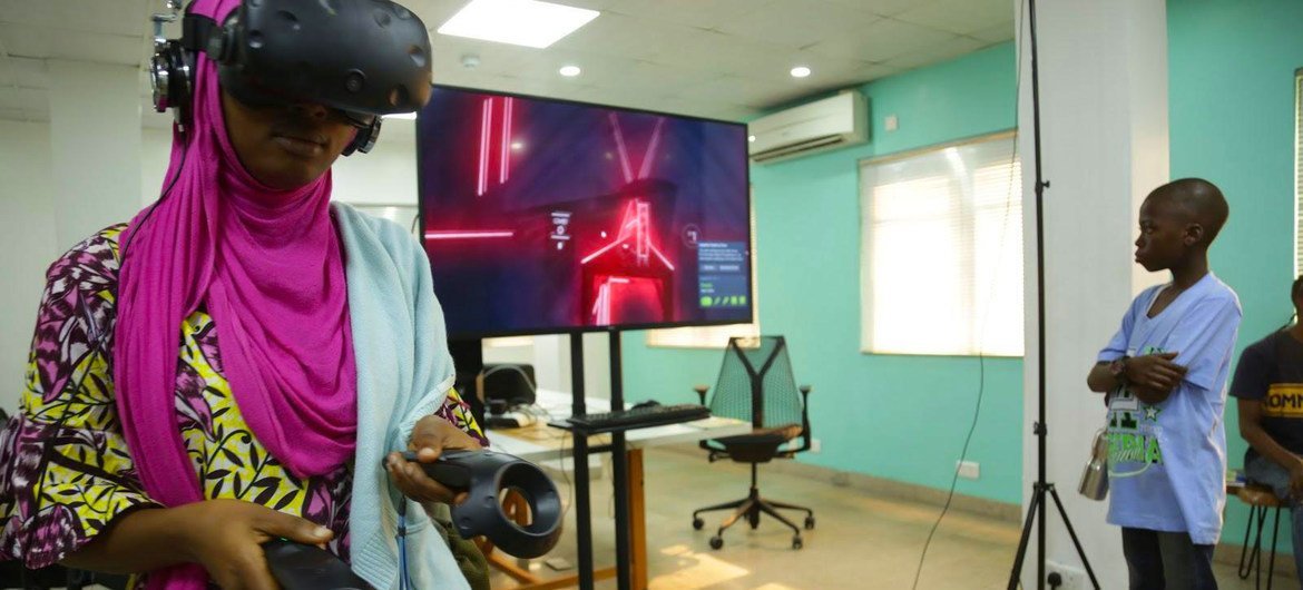 A student uses a virtual reality (VR) headset at a technology lab in Nigeria. A student uses a virtual reality (VR) headset at a technology lab in Nigeria.