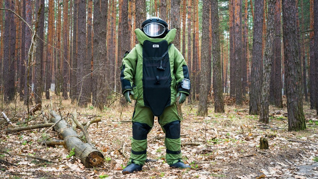 An Explosive Ordnance Disposal Specialist works in Ukraine to clear land of contamination from the war. An Explosive Ordnance Disposal Specialist works in Ukraine to clear land of contamination from the war.
