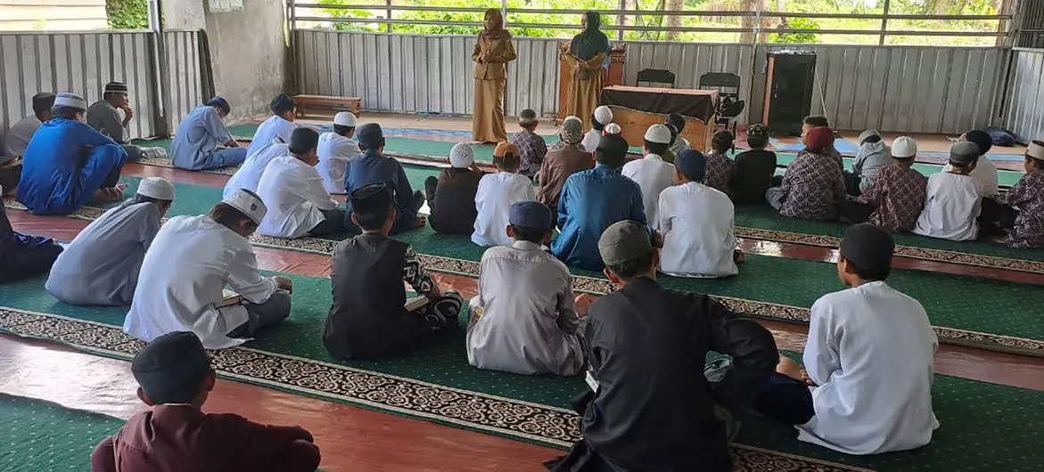 Men at religious community centre discuss gender-based and domestic violence. Men at religious community centre discuss gender-based and domestic violence.