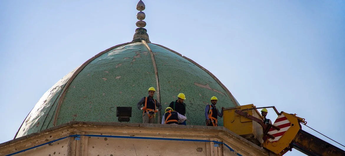 Workers repair part of the Al-Nouri Mosque in Mosul.
