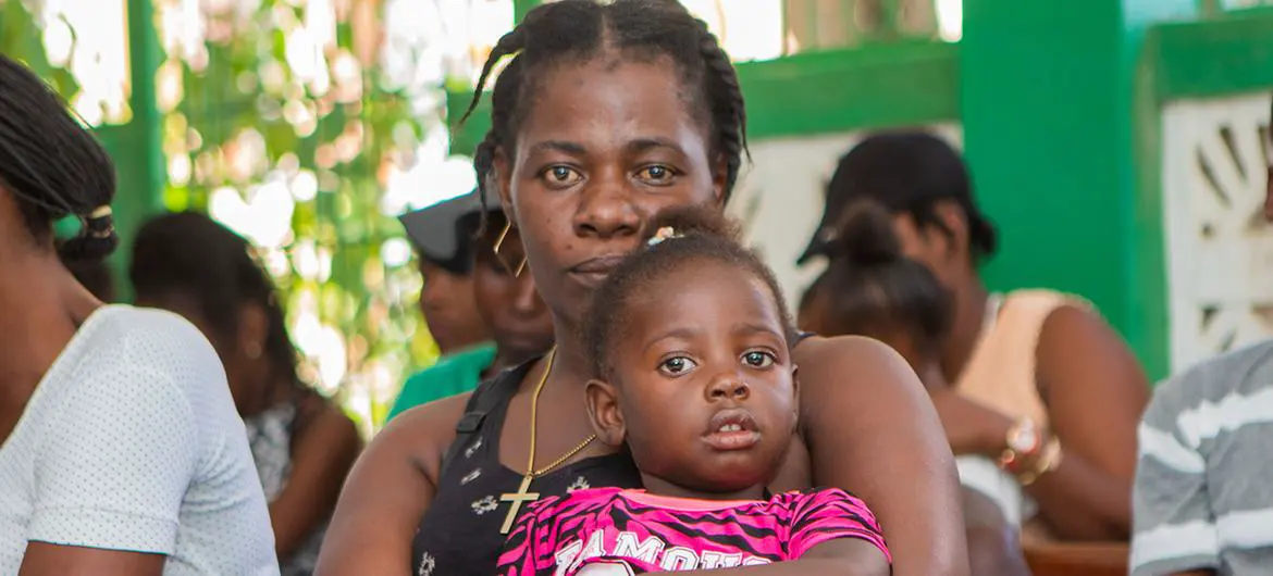 Mothers wait with their children to be vaccinated at a UNFPA-suppoted hospital in southern Haiti. Mothers wait with their children to be vaccinated at a UNFPA-suppoted hospital in southern Haiti.