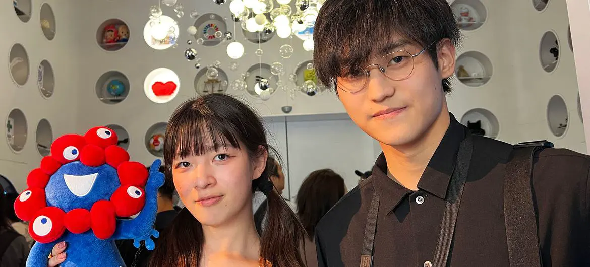 Agaka Sato (left) and Takato Ishida explore the orb room in the UN Pavilion.