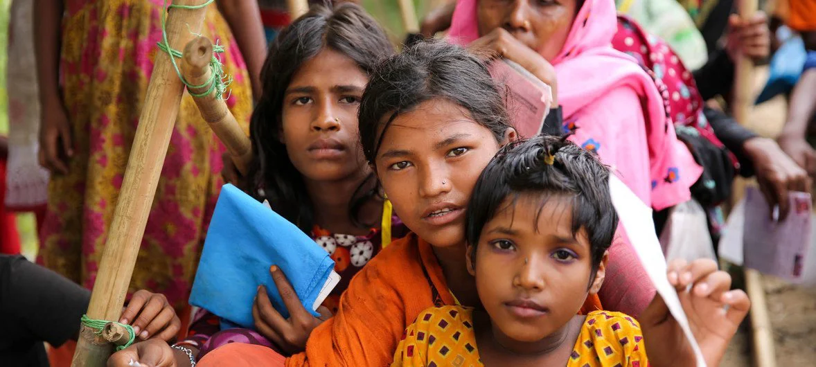 Women and children wait for aid in Cox's Bazar, Bangladesh, where one million Rohingya refugees now live.