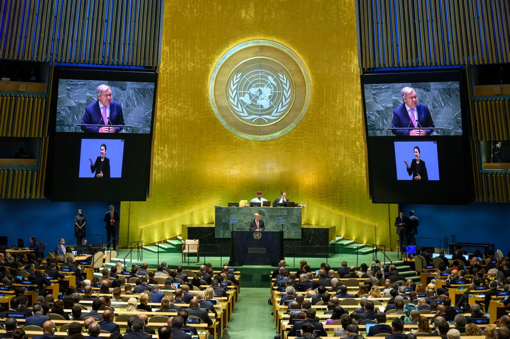Un Secretary-General António Guterres (at podium and) addresses the opening of the Summit of the Future.