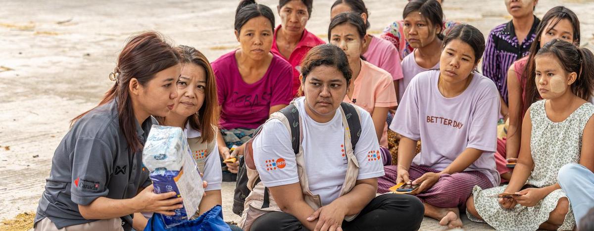 At the emergency relief item distribution, UNFPA staff introduces the content of the dignity kits and provides information on gender-based violence for earthquake- affected women and girls in Mandalay, Myanmar. At the emergency relief item distribution, UNFPA staff introduces the content of the dignity kits and provides information on gender-based violence for earthquake- affected women and girls in Mandalay, Myanmar.