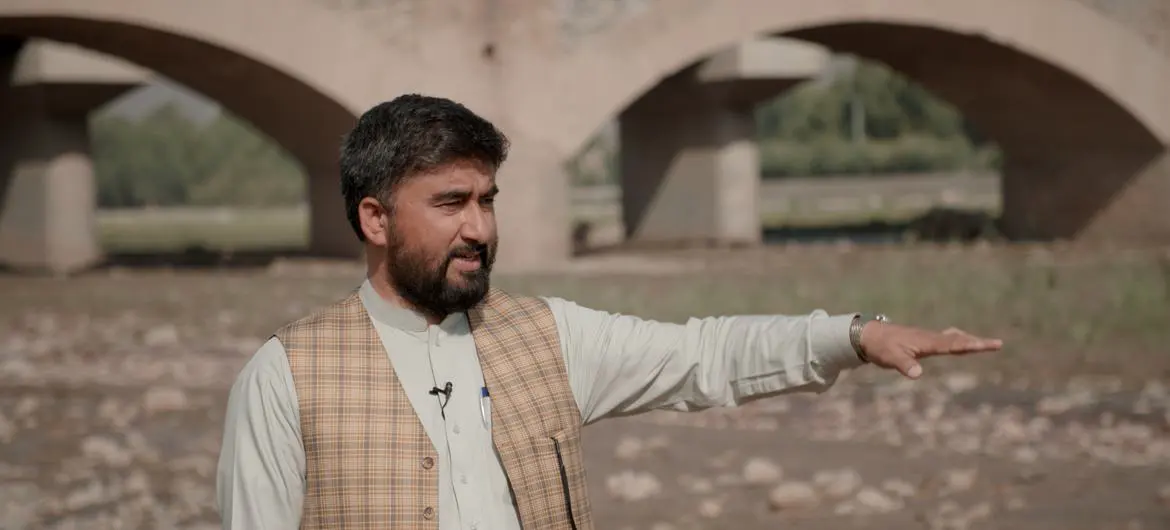 UNODC’s Hidayatullah Sapi standing on the banks the drying “Red River” in the eastern region of Afghanistan. UNODC’s Hidayatullah Sapi standing on the banks the drying “Red River” in the eastern region of Afghanistan.